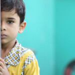 Orphaned as a baby, he has learned to function within an orphanage.