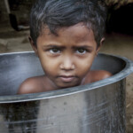 Water in the village is scarce so taking a bath in a bucket helps not to waste resources.