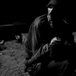 A father waiting for treatment for his son outside of the TB hospital.